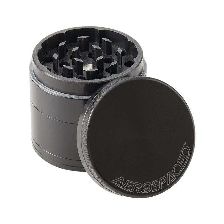 Black 4 piece Aerospaced grinder with lid off. Against a white background.