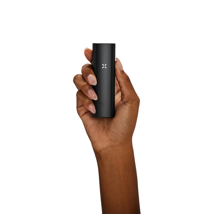 Womans hand holding Onyx Pax Plus