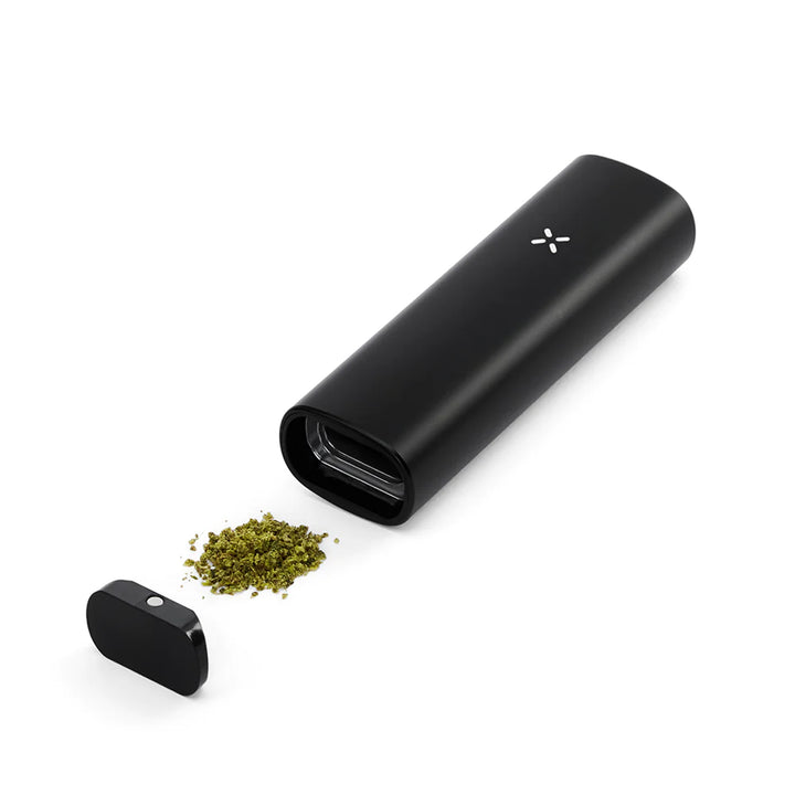 Onyx Pax Plus with open oven, next to dry herbs.