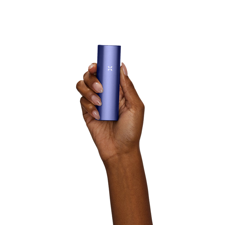 Womans hand holding Periwinkle Pax Plus